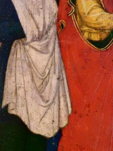 Close-up of cracked devotional painting showing red and white robes, When Love Ends in Marriage: Insights from the Bible.